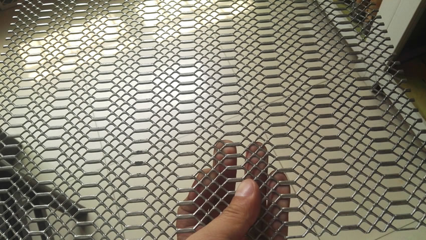 This is one piece of flattened expanded metal sheet, it has two kinds of openings: diamond and hexagonal openings.