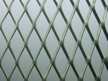 The picture shows raised expanded metal with rhombic openings.