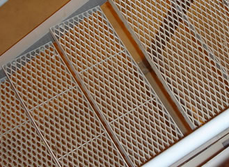 There is one stair case shown, its treads are made from expanded metal.